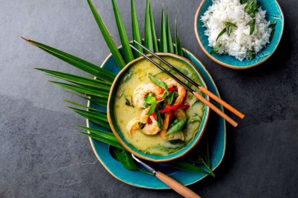 Thailand tradition Green Curry soup with shrimps prawns and coconut milk