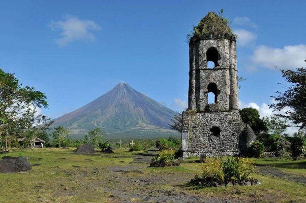 Mayon Volcano and the ruins of Cagsaua Church in the Philippines