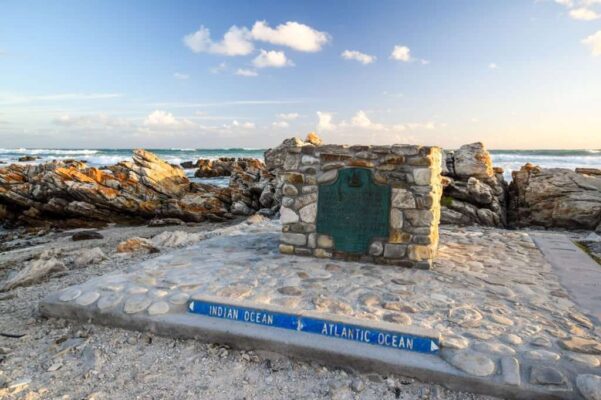 Big marker stone at Cape Agulhas(Cape of the Needles),South Africa,southernmost point of the African continent.It marks the division point between the Atlantic and Pacific Ocean