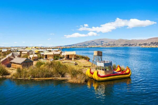 Landscape scene of a reed boat on Lake Titicaca, Puno Peru