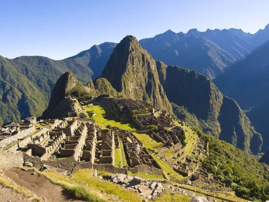 Tourist explore Machu Picchu, a 15th-century Inca citadel considered by many to be one of the New Seven Wonders of the World.