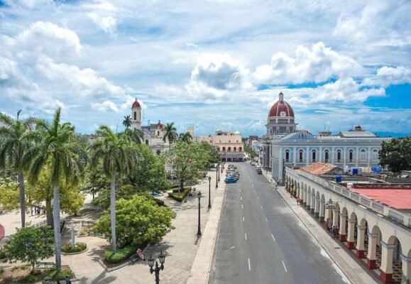 Plaza de Armas, Town Hall and Cathedral with dramatic sky, Cienfuegos, Cuba