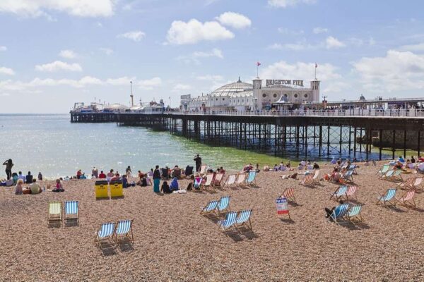 View of beach at Brighton Pier, Brighton, East Sussex, England