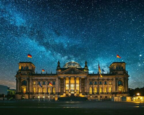 The Reichstag building in Berlin, Germany, under a starry sky