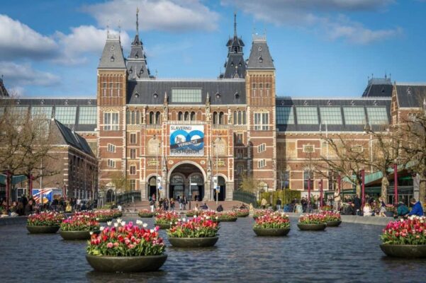 Closeup of the Rijksmuseum in Amsterdam with tulips in summer