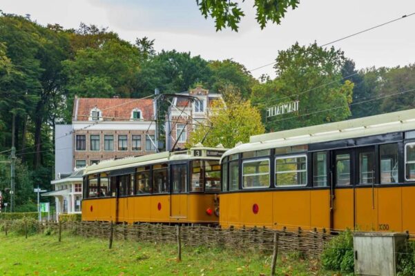 Train station with yellow historic train in Open air museum in Arnhem, Gelderland