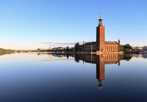 Stockholm City Hall with reflection on water at morning