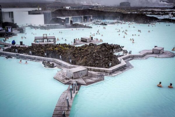 people relaxing and bathing in the stunning Geothermal Area of the Blue Lagoon