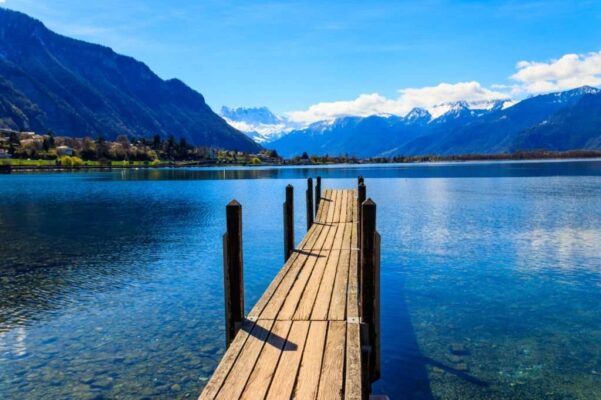 Wooden pier overlooking the Alps and Lake Geneva